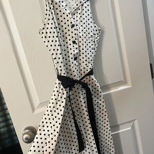 Sleeveless polka dot dress.